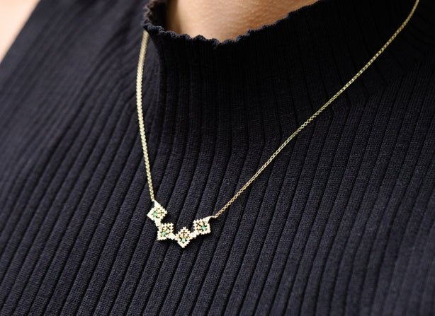 Discover Elegance with the Orange Cube Emerald Palace Necklace - Orange Cube