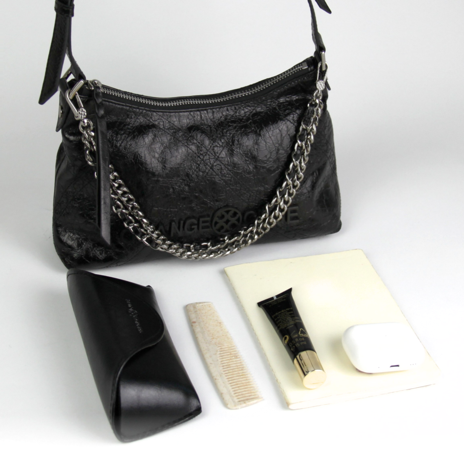 What fits inside Metropolitan Shoulder Bag - Black