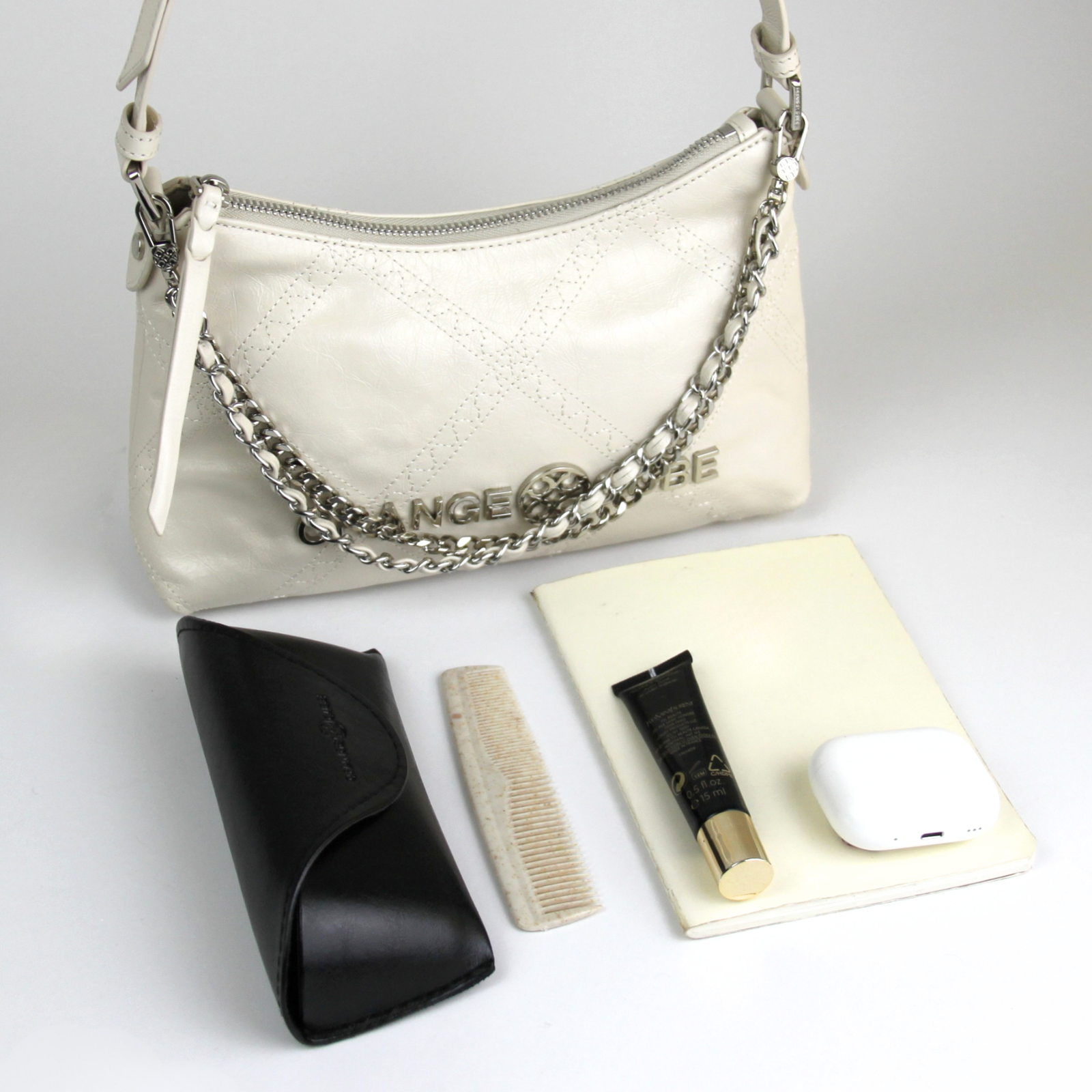 What fits inside Metropolitan Shoulder Bag - Cream