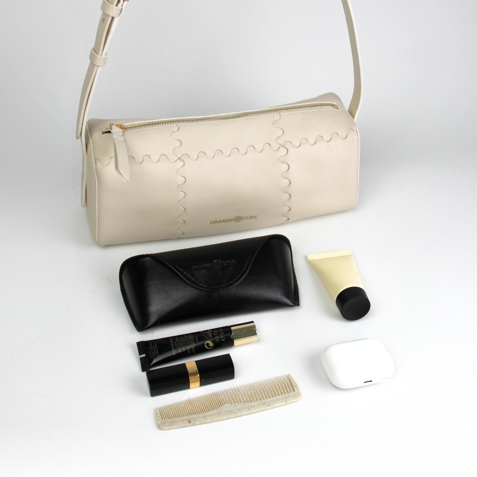 What fits inside Checkbox Shoulder Bag - White