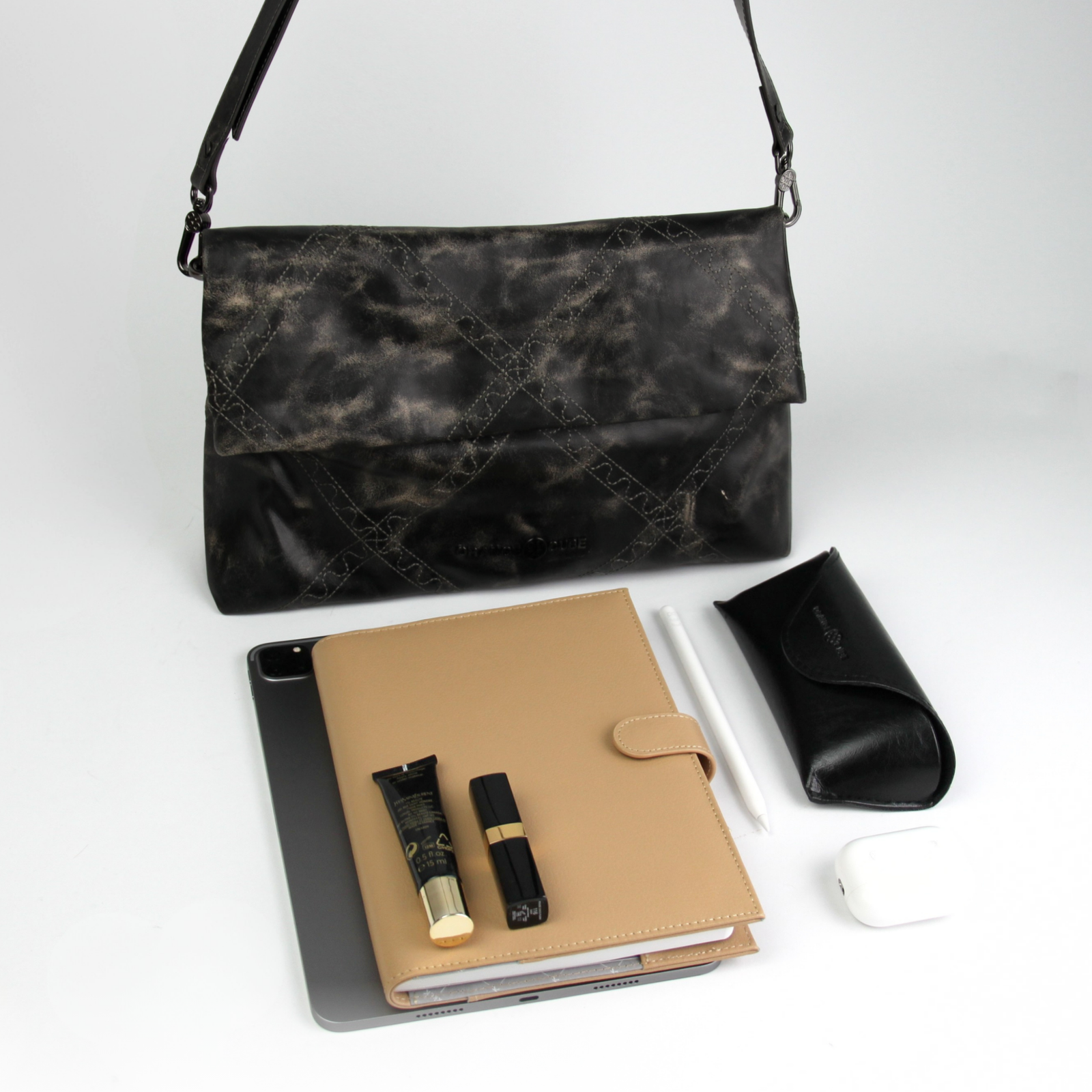 What fits inside Retro Messenger Bag - Marble Grey