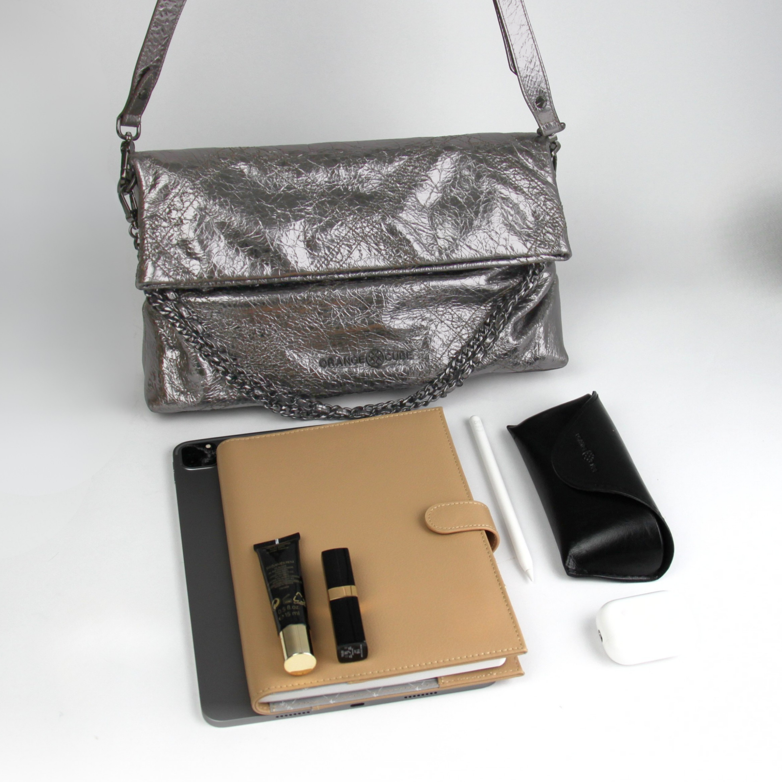 What fits inside Retro Messenger Bag - Black Silver