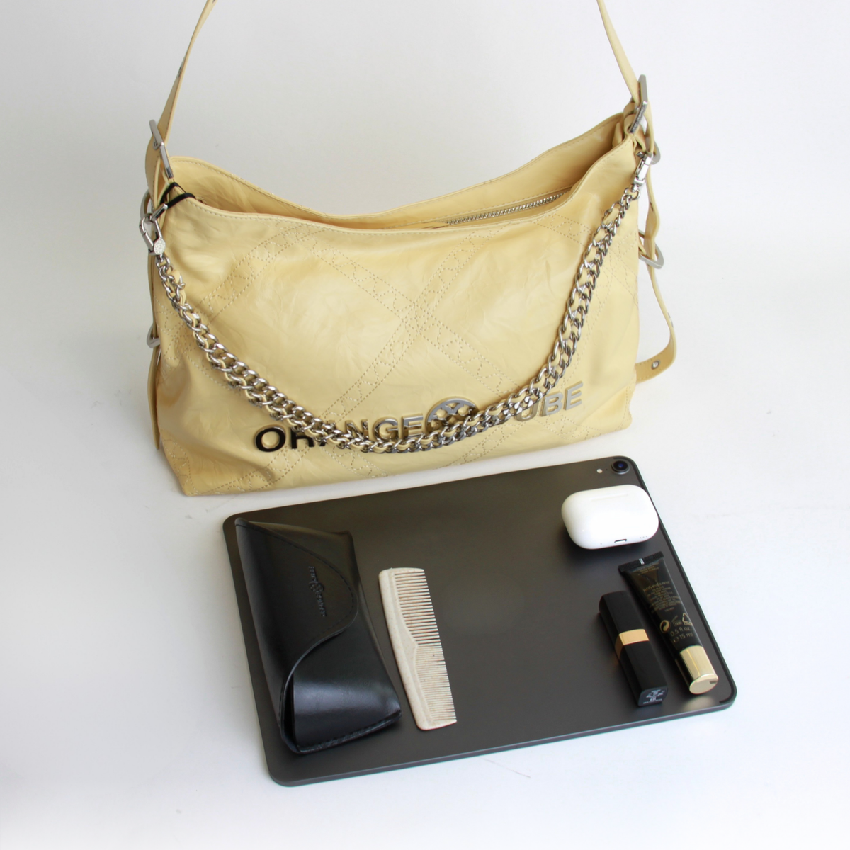 What fits inside Metropolitan Chain Hobo - Cream Yellow