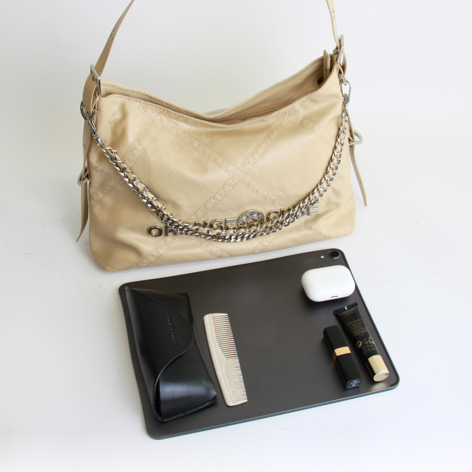 What fits inside Metropolitan Chain Hobo - Beige