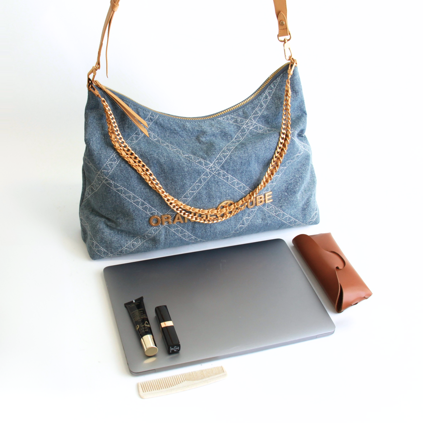 What fits inside Metropolitan Crossbody Bag - Denim